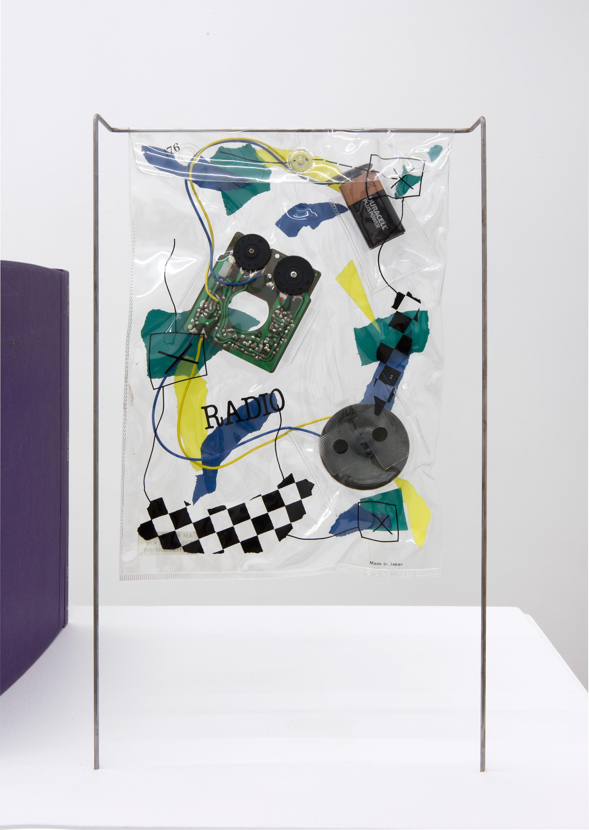 Daniel Weil, “Bag radio”, 1983, screen-printed and heat-sealed PVC, with analogue radio components and steel rod stand, 320 × 450 × 70 mm, courtesy Pentagram Design LTD
