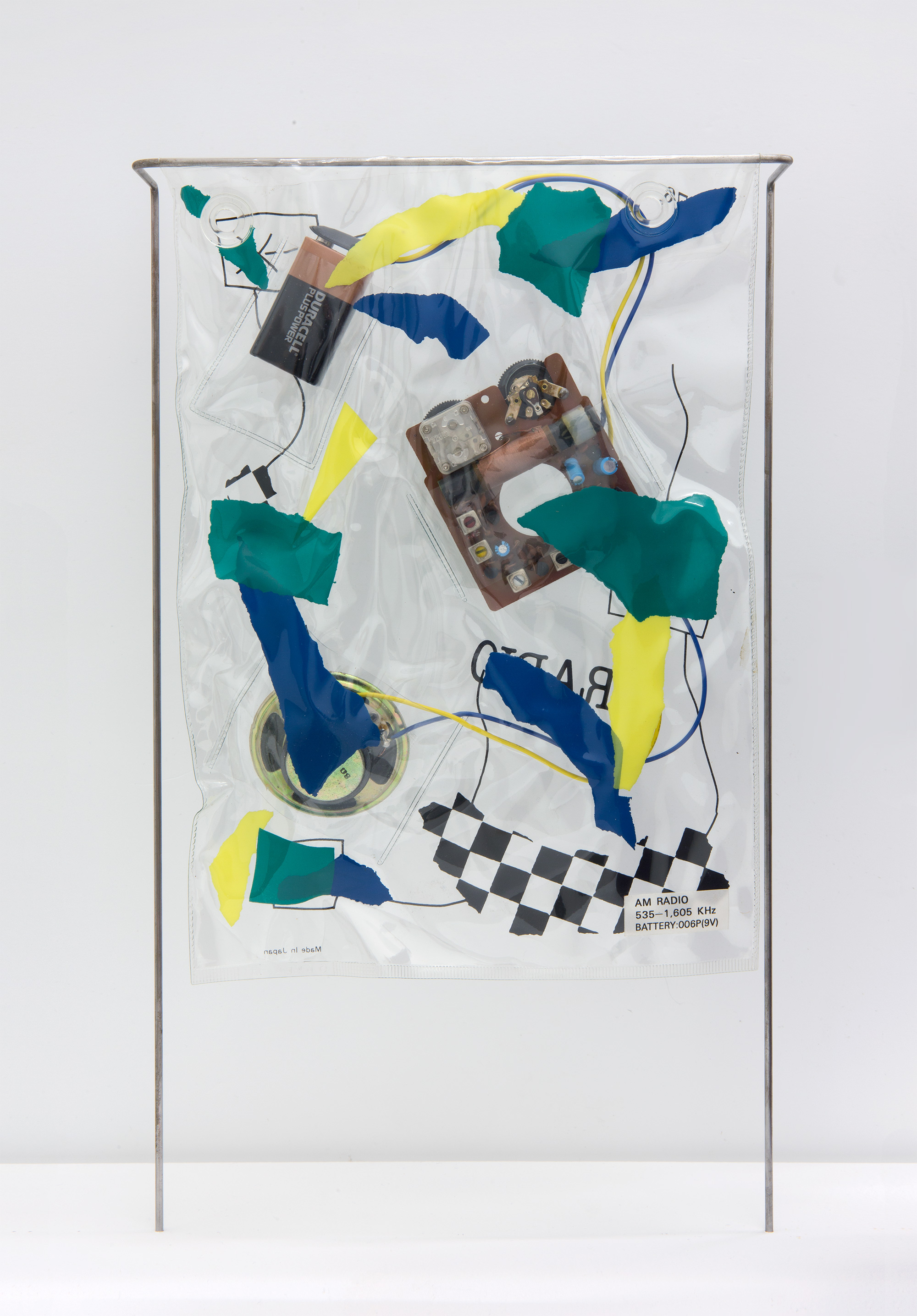 Daniel Weil, “Bag radio”, 1983, screen-printed and heat-sealed PVC, with analogue radio components and steel rod stand, 320 × 450 × 70 mm, courtesy Pentagram Design LTD