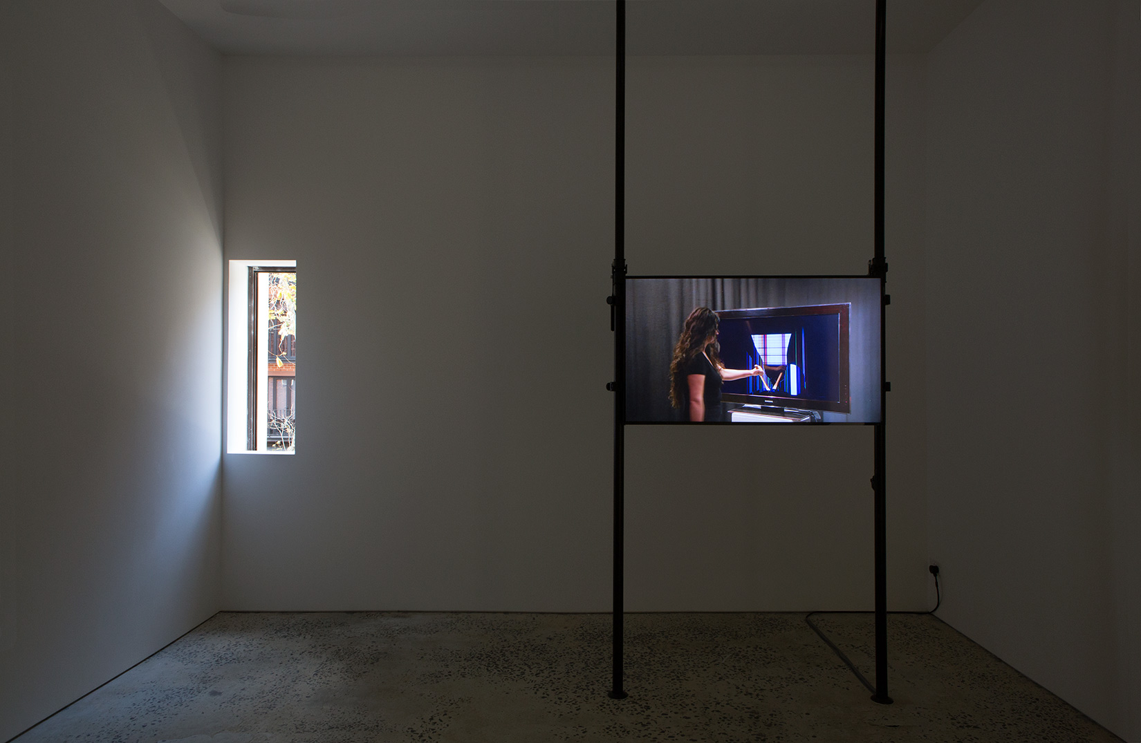 Hito Steyerl, "STRIKE", 2010, Single channel HD Video (28 sec loop), black aluminium scaffolding, 3200 × 1200 mm