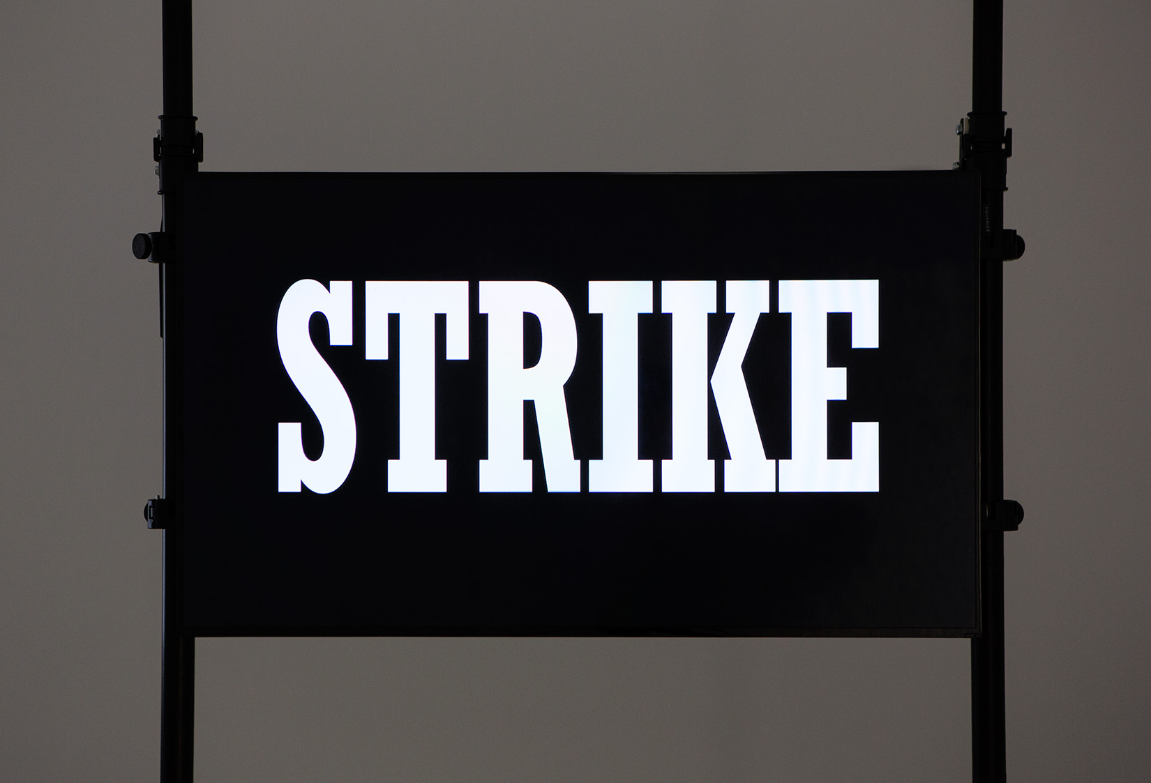 Hito Steyerl, "STRIKE" (detail), 2010, Single channel HD Video (28 sec loop), black aluminium scaffolding, 3200 × 1200 mm